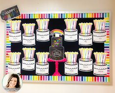 a birthday cake with many candles on it and a happy birthday sign in the background