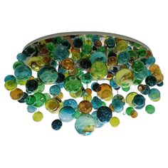 a ceiling light with many different colored glass beads