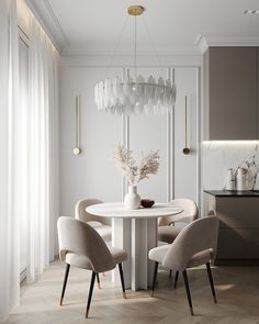 an elegant dining room with white walls and beige chairs, a round table surrounded by glass vases