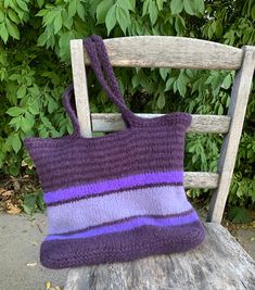 a purple bag sitting on top of a wooden chair