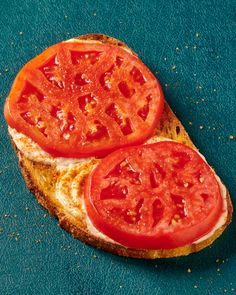 two slices of bread with tomatoes on them