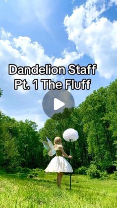 a girl in a white dress is holding flowers and standing on a pole with the words dandelion staff pt 1 the fluff