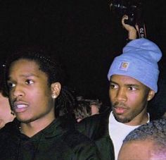 two young men standing next to each other