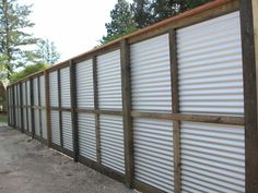 a metal fence with slats on it