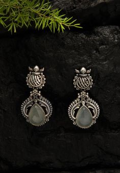 Grey Stone Studded Oxidised Earrings  Brass Based Oxidised Earrings in Silver and Grey, Adorned with Stone, Take the centre stage with this Traditional Ethnic Jewellery, handmade with intricate Indian craftsmanship and exclusively choosen from a curated collection of exquiste pieces, brought to you by Fabula. The earrings can be teamed up with festive wear and also with casual wear for a complete look.  About The Product: Grey Stone Studded Oxidised Earrings Approximate Length is 5.5 cm, Designe Saree Lengha, Oxidised Earrings, Centre Stage, Festive Wear, Jewellery Handmade, Oxidised Jewellery, Stone Studs, Oval Faces, Local Artisans