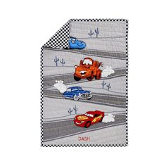 cars and trucks are depicted on this baby blanket