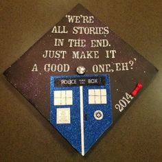 a graduation cap with the words police box on it and an image of tardishes