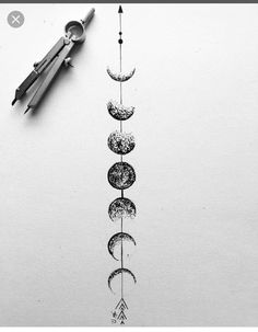 a drawing of the moon and stars with scissors on it next to some threading needles