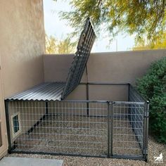 a gated in area with a chair on top of it