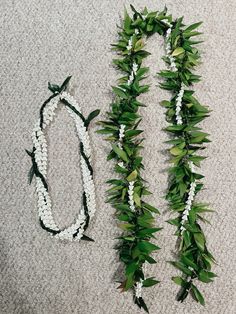 two white and green garlands laying on the floor