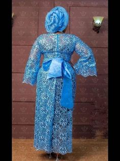 Iro and buba Floor-length Wedding Gown With Traditional Patterns, Traditional Pattern Floor-length Wedding Gown, Traditional Patterned Floor-length Wedding Gown, Traditional Pattern Floor-length Sets For Wedding, Traditional Pattern Floor-length Wedding Sets, Elegant Blue Gown For Ceremony, Elegant Gown With Traditional Patterns For Ceremonies, Elegant Wedding Gown With Traditional Patterns, Elegant Formal Dresses With Traditional Patterns