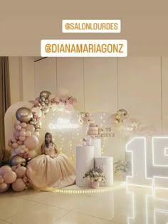 a room filled with balloons and cake on top of a table next to a wall