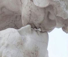 a close up view of the face and head of a statue