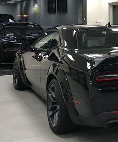 a black sports car parked in a garage