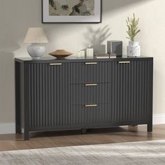 a sideboard with three drawers and two lamps