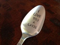 a spoon with the words i love you a latte written on it