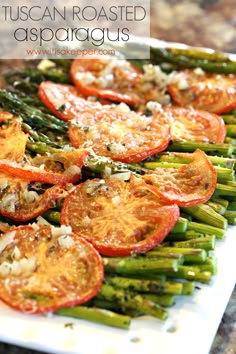 asparagus, tomatoes and other vegetables on a white plate with text overlay