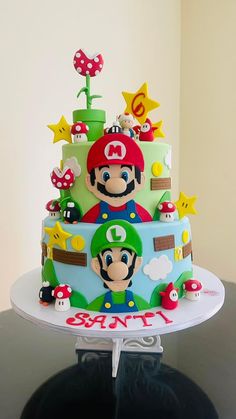 a birthday cake decorated with mario and other characters