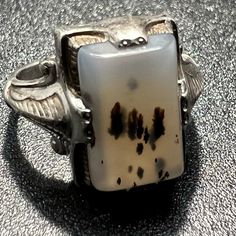 Condition: Pre-Owned / Good Metal: Sterling Silver Stone Type: Montana Agate Number Of Stones: 1 Maker: Clark & Coombs Markings: C & C Sterling Stone Size: 12mm X 8mm Ring Size: 6 Band Width: 2mm - 7.5mm Item Weight: 3.1 Grams Montana Agate, Deco Ring, Womens Clarks, Agate Ring, Art Deco Ring, Womens Jewelry Rings, Montana, Agate, Vintage Jewelry