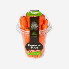 carrots in a plastic container with a black label on the front and bottom side