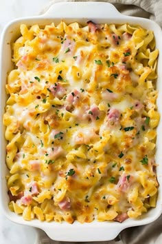 a casserole dish filled with ham and cheese