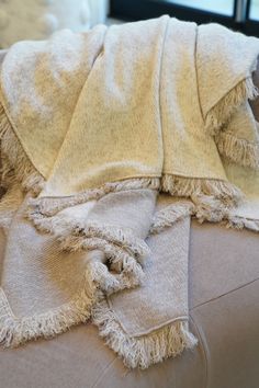 Drape yourself in the sumptuous embrace of the Colette Cashmere Blanket, where luxury meets ultimate coziness. This piece is woven from the softest cashmere and features a mesmerizing ombre toast palette that whispers of comfort with its rich toast melting into a serene creamy beige. It’s a visual and tactile experience. It’s perfect for wrapping around yourself on a cool evening or as an inviting throw over your favorite couch. The playful fringes add a touch of whimsy, enhancing the blanket’s Cable Knit Dress, Knitted Skirt, Cashmere Blanket, Rose Shop, Summer Sweaters, Sweater Collection, Knit Skirt, Knit Dress, Cable Knit