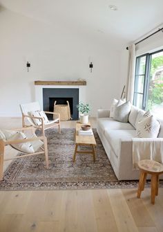 a living room filled with furniture and a fire place