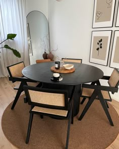 a black table with four chairs around it