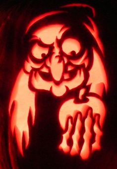 a carved pumpkin with an owl on it