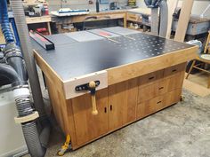 a workbench in a shop with tools on it