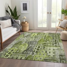 a living room with green rugs and chairs