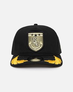 the new era snapback hat in black and gold with an embroidered snake on the front