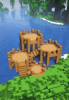 three wooden structures in the middle of a lake