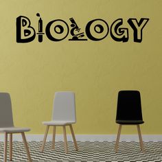 three chairs sitting in front of a wall with the word biology on it