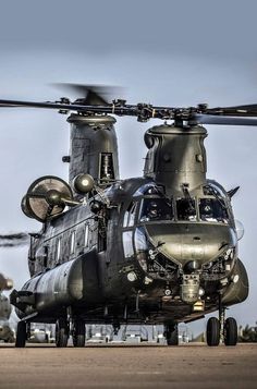 a large helicopter sitting on top of an airport tarmac