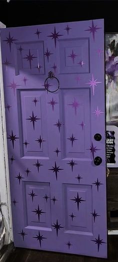 a purple door with stars painted on it