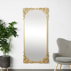 Place this ornate wall or floor mirror in a sunlit parlor or at the end of an elegant corridor, its radiant reflections and intricate detailing will create an enchanting focal point. This item ships in 1 carton. Can be leaned, stand or hung against the wall vertically using the keyholes; nails and screws not included. Suitable for indoor use only. This item ships fully assembled in one piece. This is a single gold or bronze colored entryway mirror. Modern Farmhouse, vintage or traditional style. Ornate Floor Mirror, Free Standing Mirror, Entryway Mirror, Kelly Clarkson Home, Mirror Vintage, Wood Wall Mirror, Mirror Gold, Metal Floor, Standing Mirror