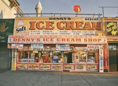 an ice cream shop on the corner of a street