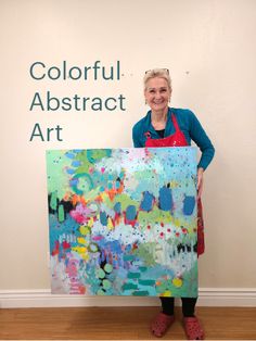 a woman standing in front of a colorful abstract art painting with the words, colorful abstract art