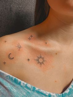 a woman's chest with stars and moon tattoos on her left shoulder, which is also visible in the upper half