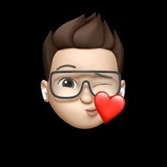 a man with glasses holding a red heart