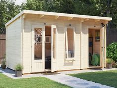 a small wooden shed with doors open