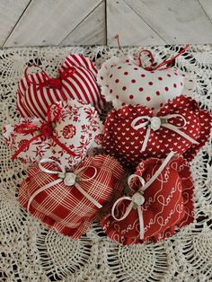 several red and white hearts on a doily