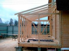 a house being built with wooden framing