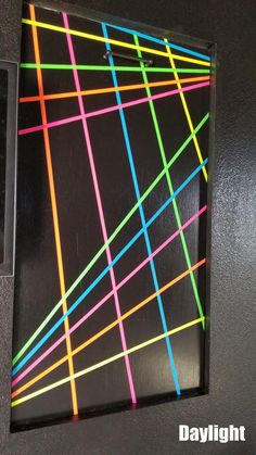 a black box with multicolored lines on it