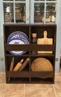 a wooden shelf filled with lots of different items