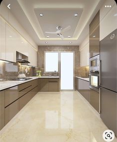 a modern kitchen with stainless steel appliances and marble counter tops, along with white walls