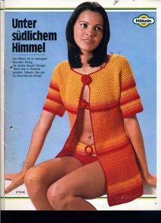 a woman in an orange and yellow knitted sweater