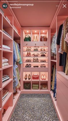 a walk in closet with pink walls and shelving