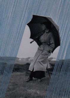 an old photo of a woman holding an umbrella over her head while standing in the rain